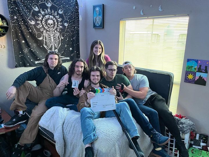 Cast and crew with the slate