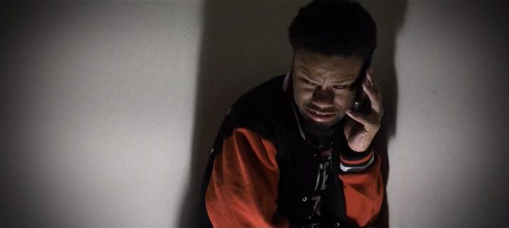 A tense phone call against a bare wall