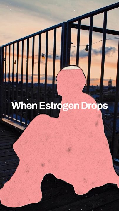 A pink paper cutout figure over a city skyline at dusk