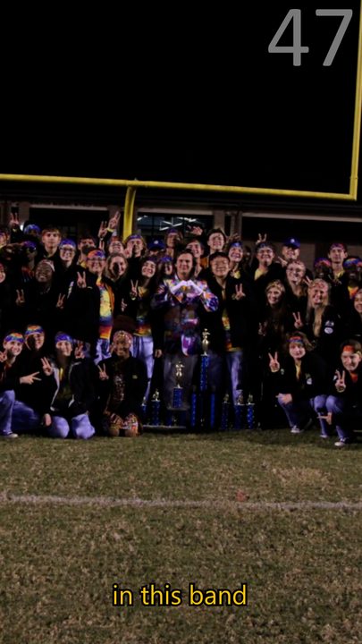 The Swarm Marching Band celebrating on the football field