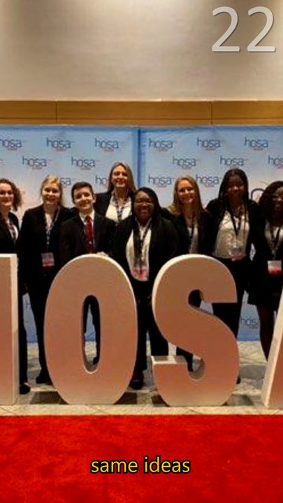 HOSA members posing with giant letters at a conference